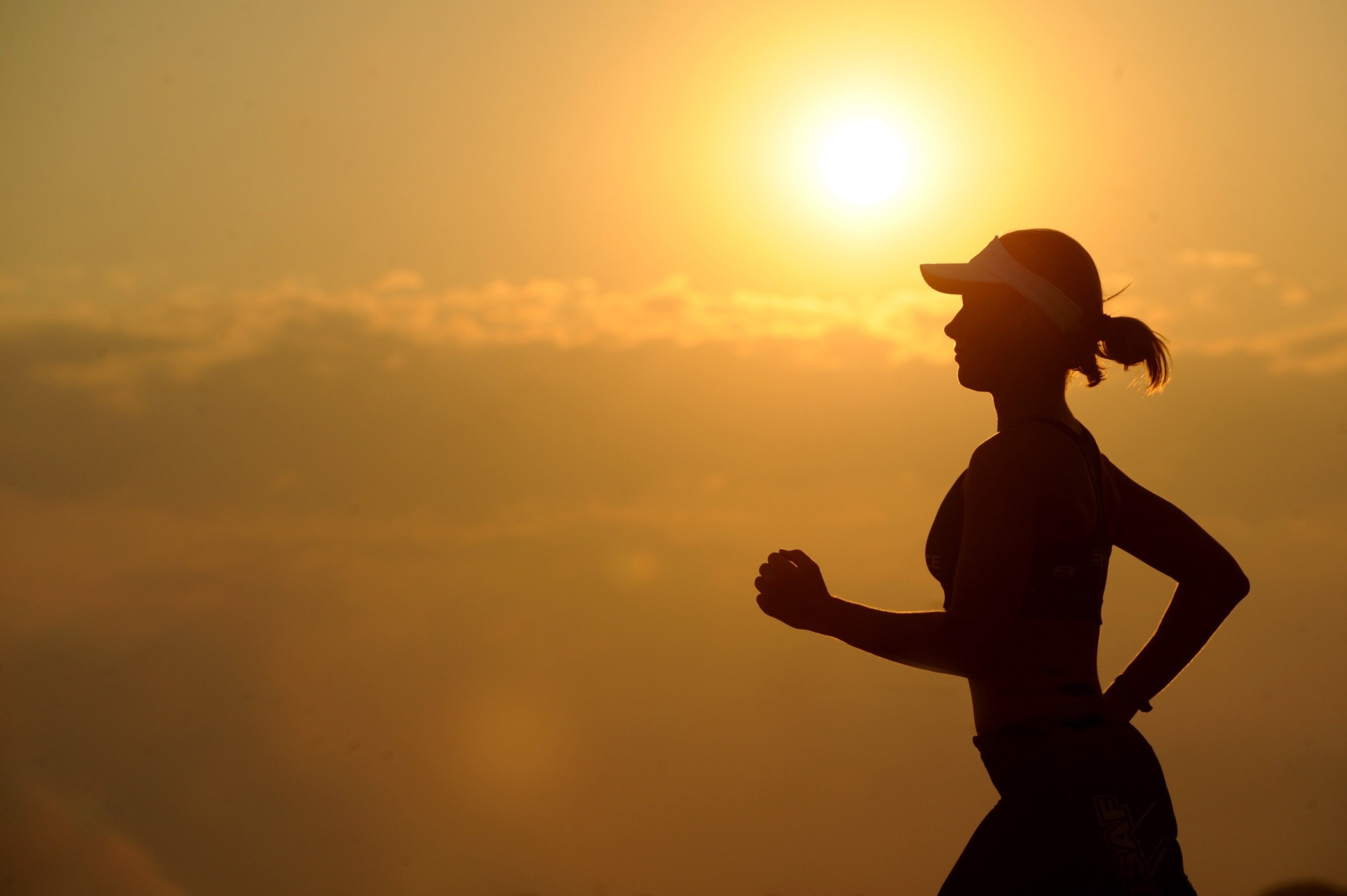 Female runner at sunset